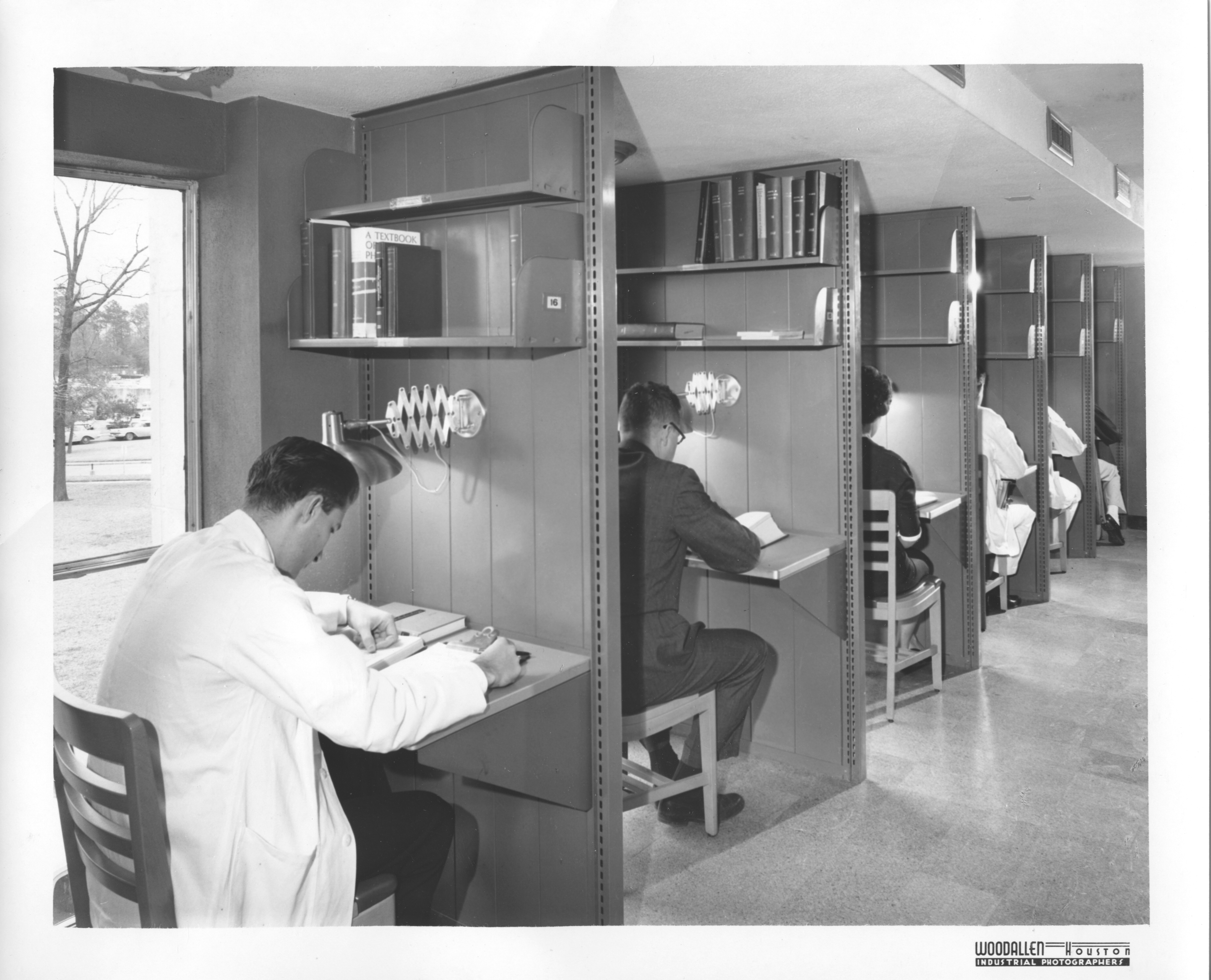 Study Carrells, 1961. Medical students use individual study spaces in the library. IC001 HAM-TMC Library records (OV 100), IC098 HAM-TMC Library Historical Photograph Collection (P-3359, OV 93), McGovern Historical Center