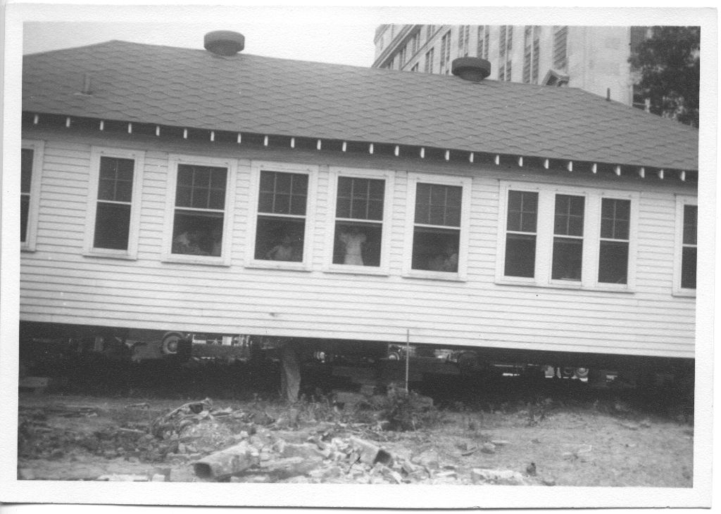 The clinic and offices of the Houston Anti-Tuberculosis League on Bagby St. were moved and reinforced away from the eroding banks of the bayou, 1936. Sure, the children can stay inside! [IC 034 San Jacinto Lung Association records, Box 5, P-727, McGovern Historical Center, Texas Medical Center Library.]