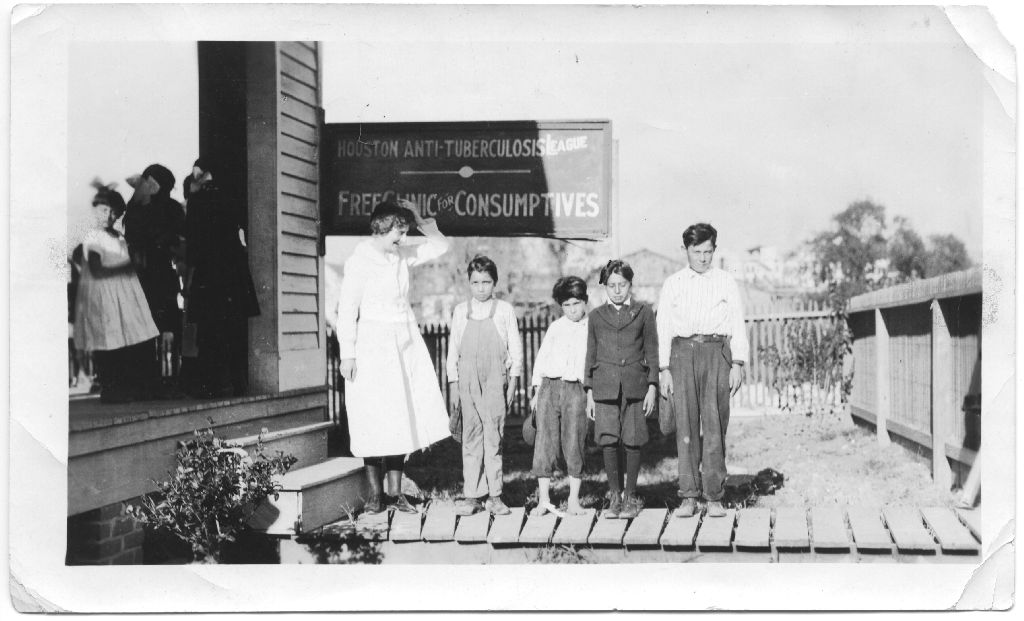 Children and Nurse outside Houston Anti-Tuberculosis League and Free Clinic, c. 1920. [San Jacinto Lung Association records, Box 5, P-920, McGovern Historical Center, Texas Medical Center Library.]