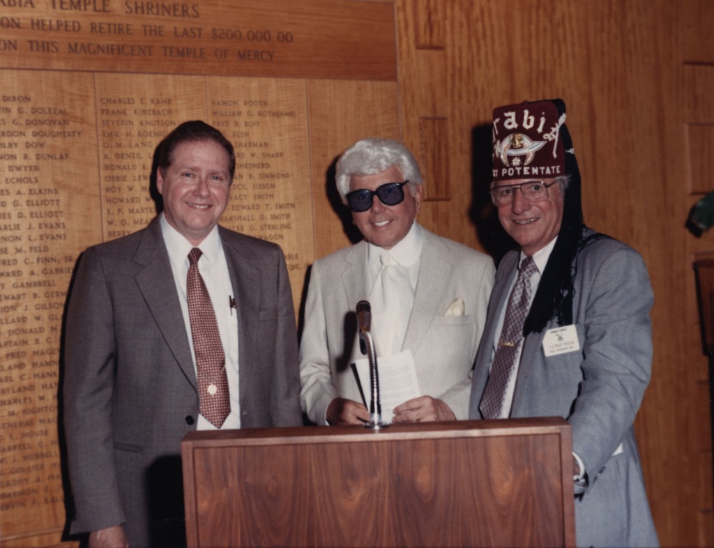 Dr. Richard E. Wainerdi with Marvin Zindler at Shriners. [McGovern Historical Center, IC 002 Texas Medical Center records, Box 56]