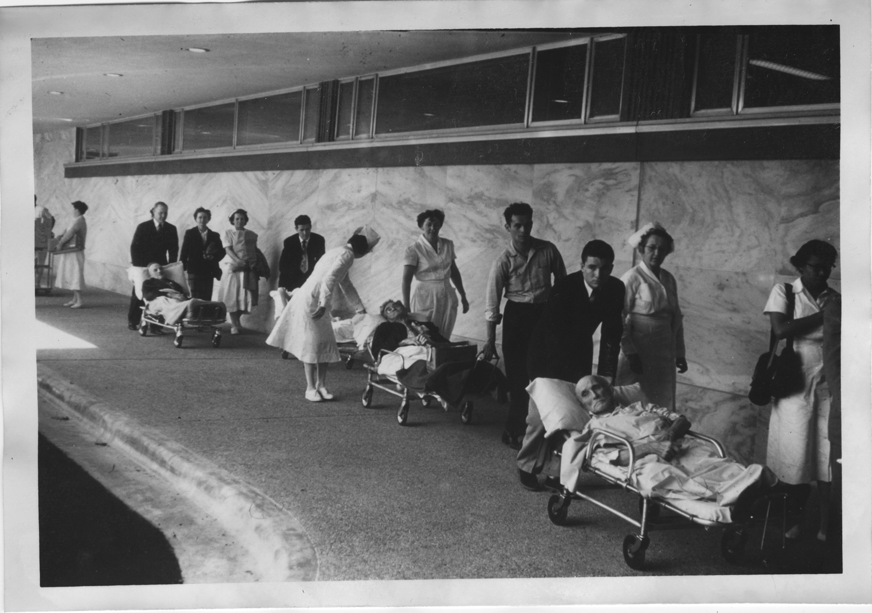 Patients being wheeled into the new hospital, 1954 (MS070 Series VIII, Box 185, folder 5)