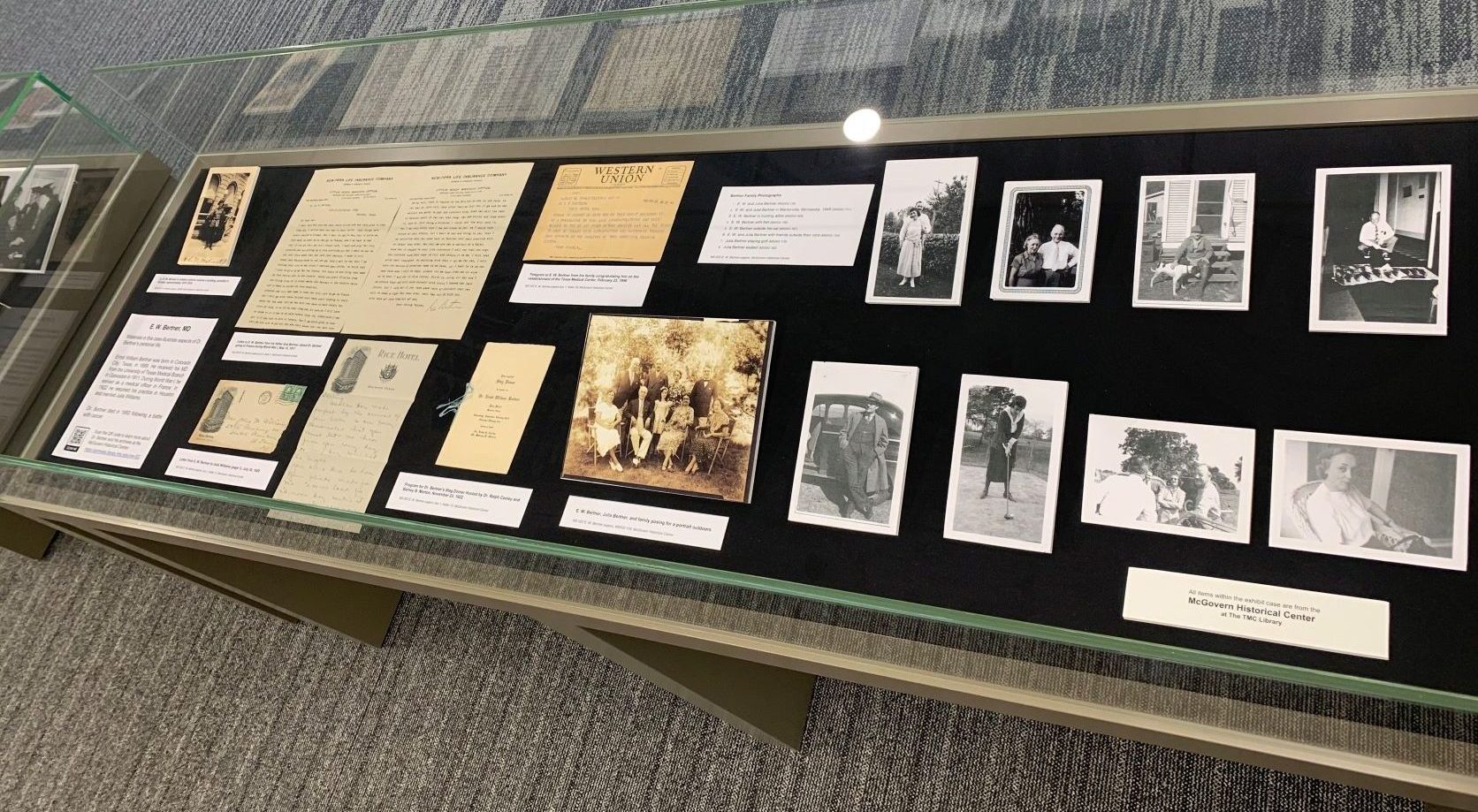 The second case in the exhibit features documents and photographs illustrating Dr. Bertner's personal life. 