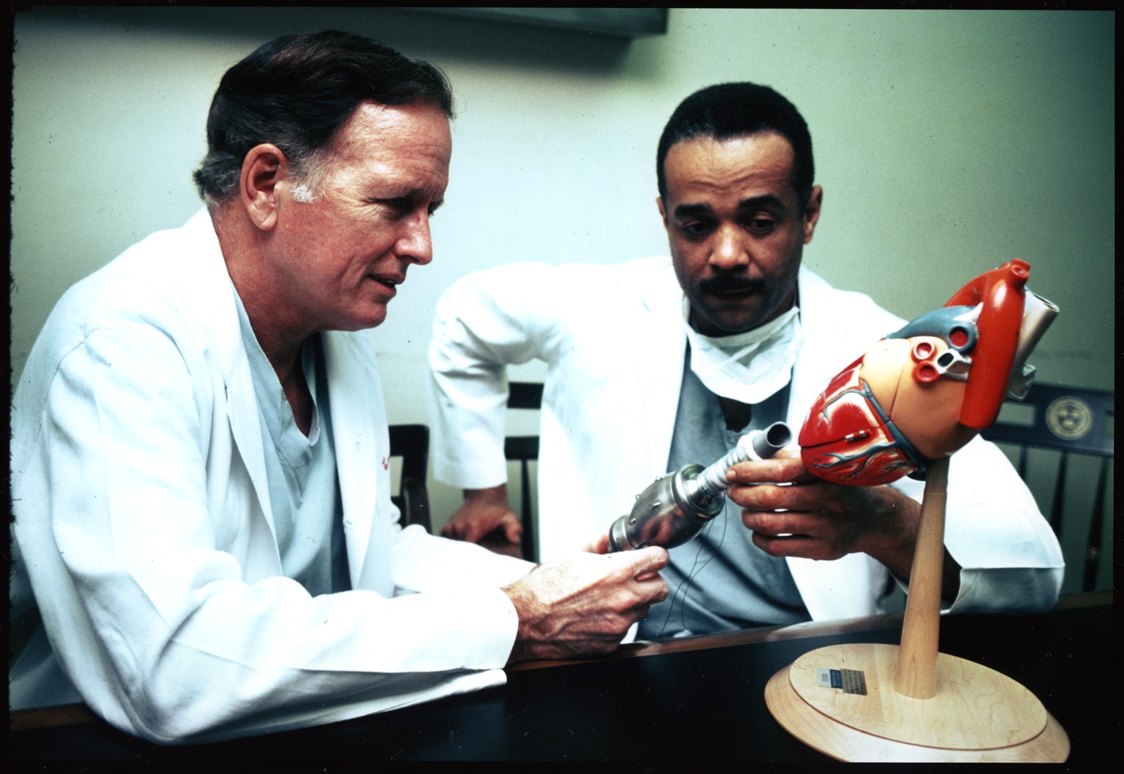 Dr. Cooley and Dr. Norman with heart model, 1976
