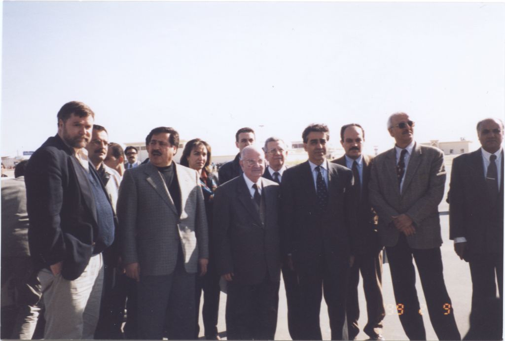 Delegation watches as the cargo plane with medical supplies arrives at Yasser Arafat International Airport in Gaza on February 9, 1999. [IC 105 Texas Hadassah Medical Research Foundation records, McGovern Historical Center, TMC Library, IC105-012]