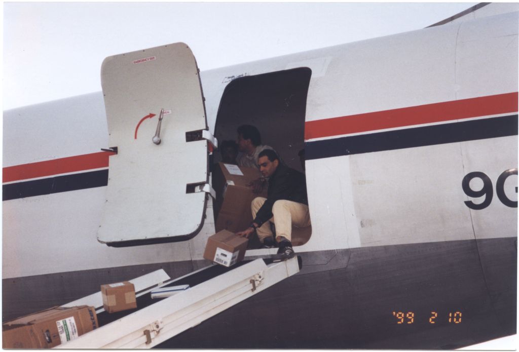 Medical supplies are unloaded from the cargo plane at at Yasser Arafat International Airport in Gaza on February 9, 1999. [IC 105 Texas Hadassah Medical Research Foundation records, McGovern Historical Center, TMC Library, IC105-020]