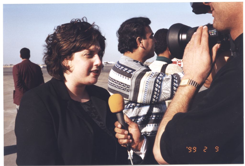 Debbie Goldberg, Executive Director of Texas Hadassah Medical Research Foundation, talks to media at Yasser Arafat International Airport in Gaza on February 9, 1999. [IC 105 Texas Hadassah Medical Research Foundation records, McGovern Historical Center, TMC Library, IC105-023]