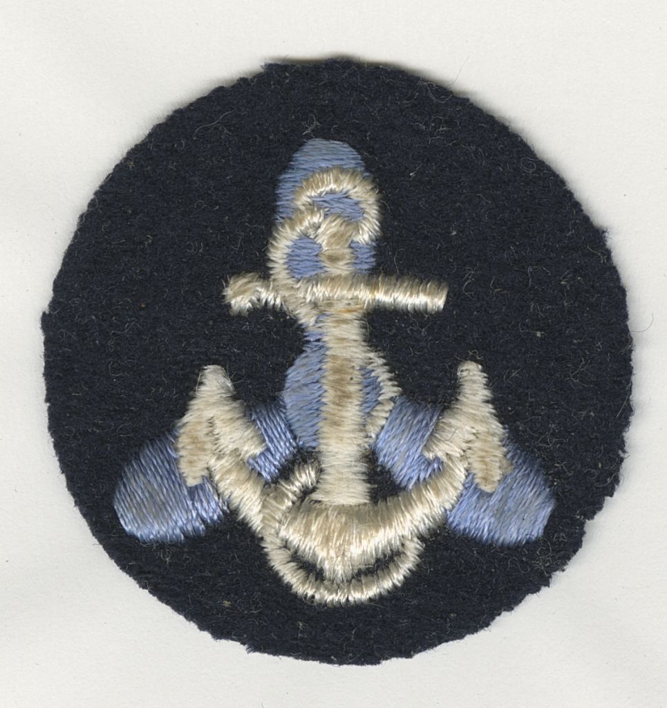 [U. S. Naval Reserve Women's Reserve insignia of propeller and anchor, circa 1944. MS054-b1f4-005, Murdina MacFarquhar Desmond, MD papers, McGovern Historical Center, Texas Medical Center Library] 