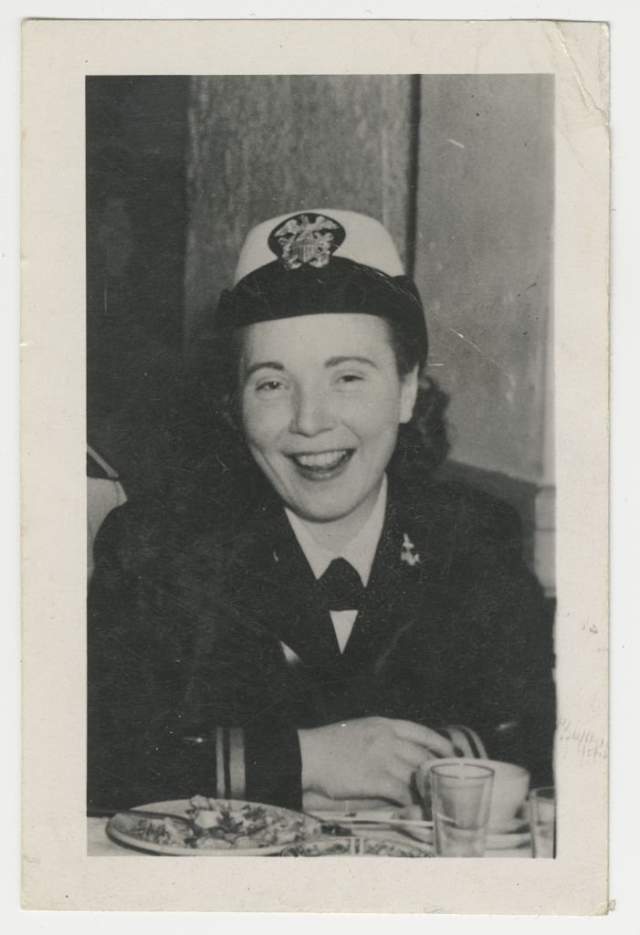 [Murdina M. Desmond in military service uniform sitting at dining table, circa 1944. MS054-b1f4-006, Murdina MacFarquhar Desmond, MD papers, McGovern Historical Center, Texas Medical Center Library] 