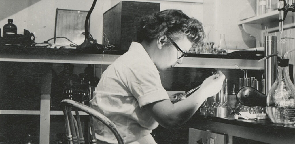 Murdina MacFarqurah Desmond working in a laboratory at George Washington University, 1947-1948