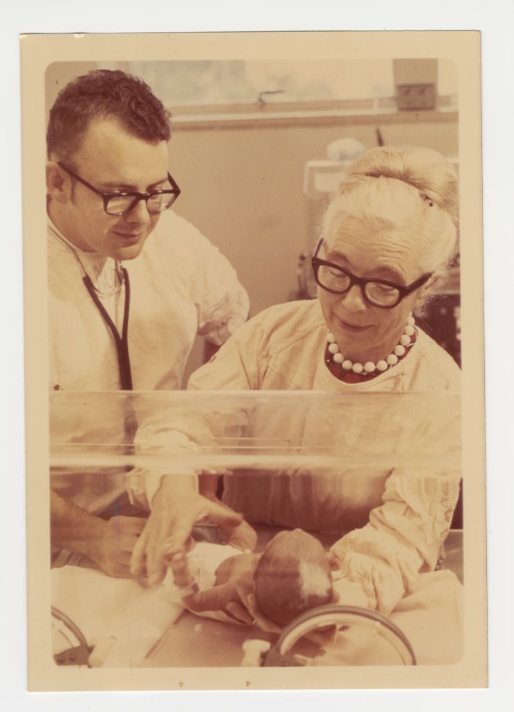 [Dr. Paul Gillette and Dr. Murdina Desmond examine an infant in an incubator, circa 1970. MS054-b1f5-008, Murdina MacFarquhar Desmond, MD papers, McGovern Historical Center, Texas Medical Center Library]
